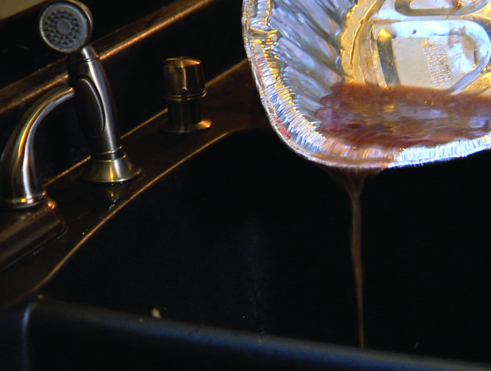 pouring grease down kitchen sink